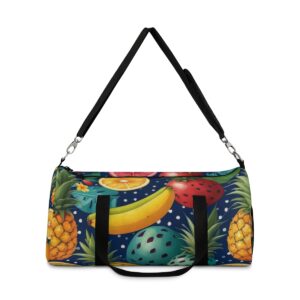 duffel bag with vibrant tropical fruit pattern featuring pineapples, bananas, and watermelon on a dark background and detachable shoulder strap