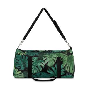 Duffel bag with dark green tropical leaf pattern and detachable shoulder strap