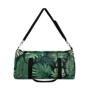 Duffel bag with dark green tropical leaf pattern and detachable shoulder strap