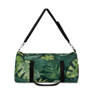 Duffel bag with lush tropical leaf design and detachable shoulder strap