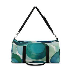 Duffel bag with large overlapping circular patterns and adjustable shoulder strap