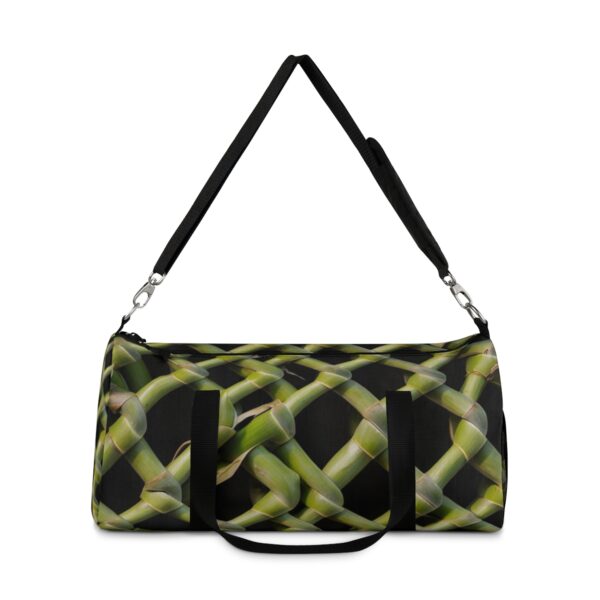 duffel bag with green woven bamboo pattern and detachable shoulder strap