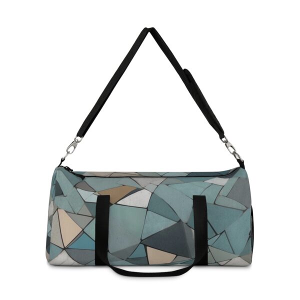 Duffel bag with mosaic-style geometric shapes and adjustable shoulder strap