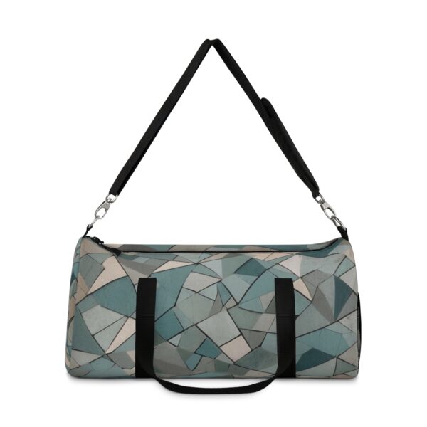 Duffel bag with abstract geometric shapes and adjustable shoulder strap