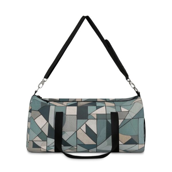 Duffel bag with abstract geometric pattern and adjustable shoulder strap