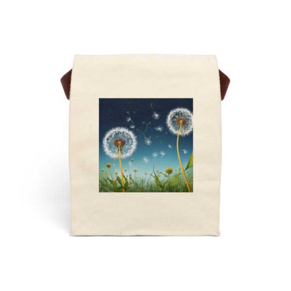 Canvas lunch bag with strap featuring a dandelion field with seeds blowing in the wind design