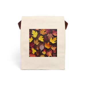 Canvas lunch bag with strap featuring a design of autumn leaves in warm tones of yellow, orange, and red