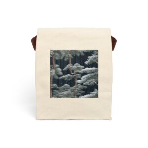 Canvas lunch bag with strap featuring a design of snow-dusted evergreen branches in a dark forest setting