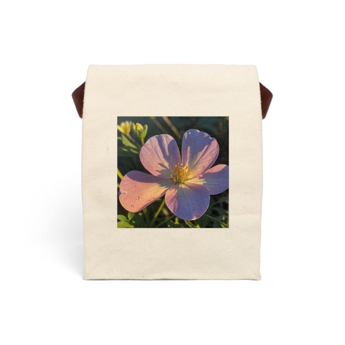 Canvas lunch bag with strap featuring a close-up of a pink flower in sunlight