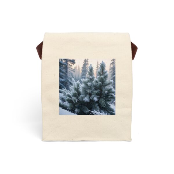 Canvas lunch bag with strap featuring a winter design of snow-covered evergreen trees in a frosty forest