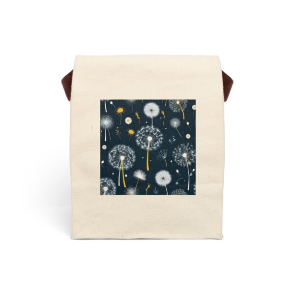 Canvas lunch bag with strap featuring a dandelion seed pattern with yellow accents on a dark background