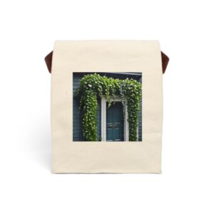 Canvas lunch bag with strap featuring a cascading ivy around a blue doorway design