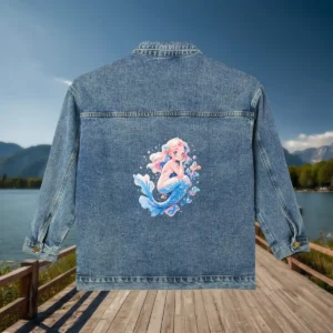 Flat view of a denim jacket with a sparkling mermaid illustration in pastel tones on the back.