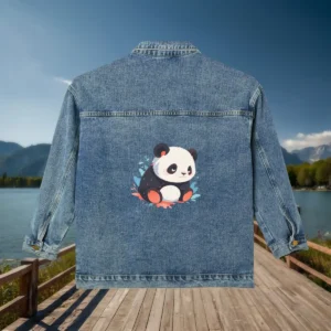 Flat view of a denim jacket with a cartoon-style panda sitting among leaves printed on the back.