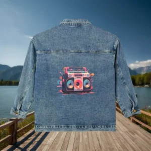 Flat view of a denim jacket with a retro-style boom box illustration in bright colors.