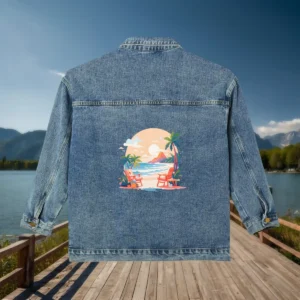 Flat display of a denim jacket featuring a colorful beach vacation scene with palm trees and lounge chairs printed on the back.
