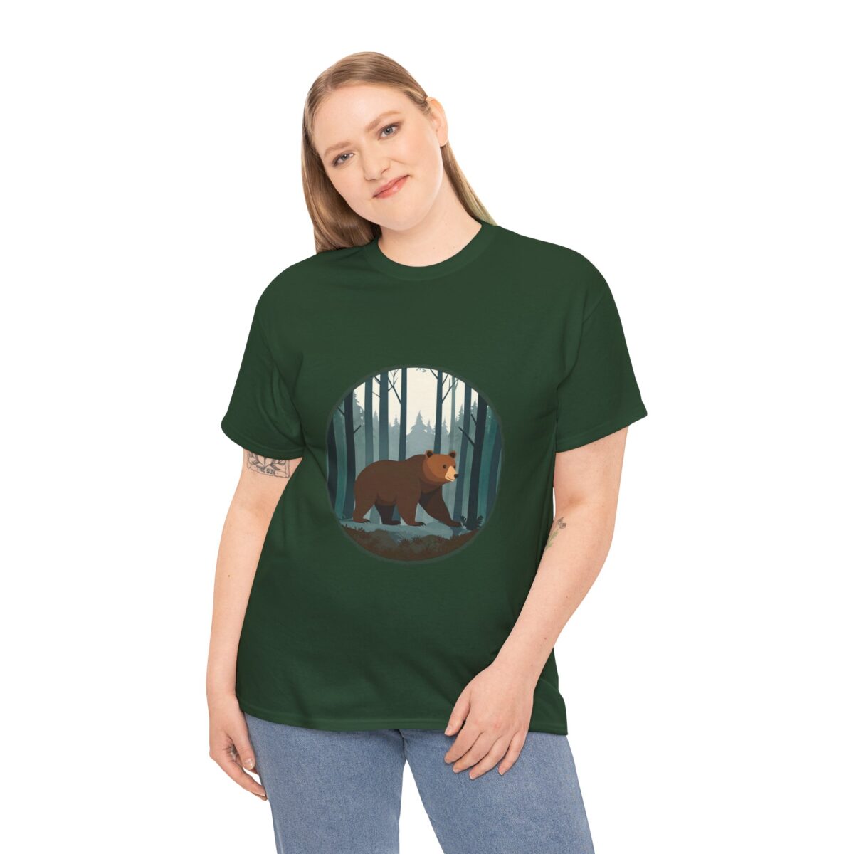 Woman wearing a Bear T Shirt with a bear and forest design on a green background