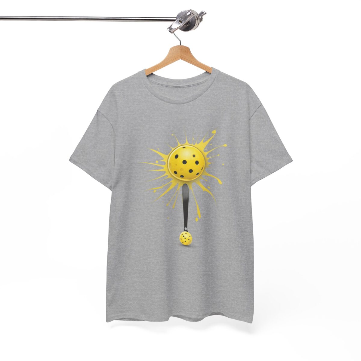 Pickleball t-shirt hanging on a wooden hanger, showcasing its unique design.