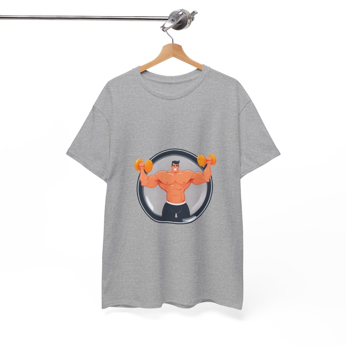 Gray funny T-shirt for men hanging on a wooden hanger, featuring a muscular cartoon character lifting dumbbells.