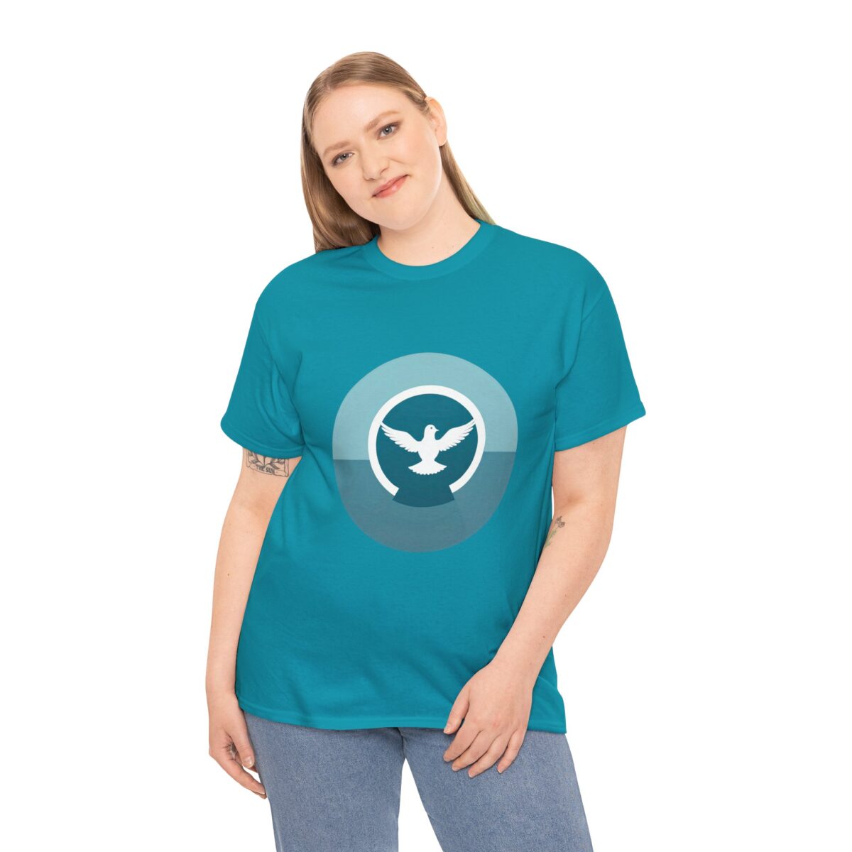 Woman wearing a Christian Graphic T Shirt​ with a dove design symbolizing peace.