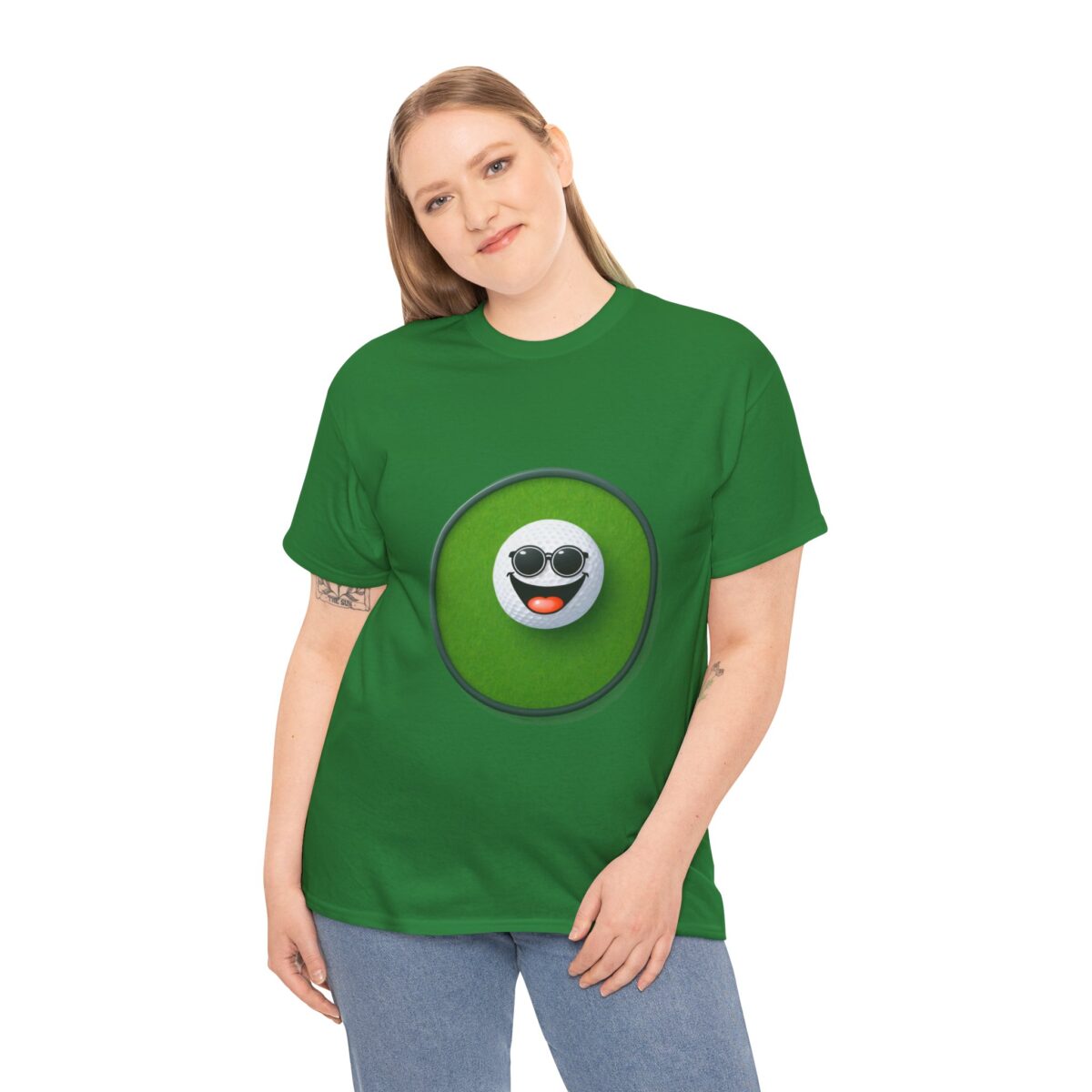 Woman wearing a green Golf T Shirt with a smiling golf ball design.