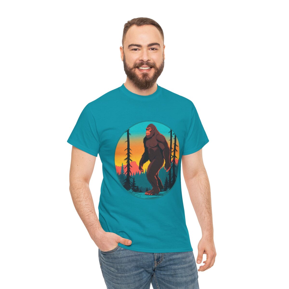 Man wearing a Bigfoot T Shirt featuring a forest sunset design