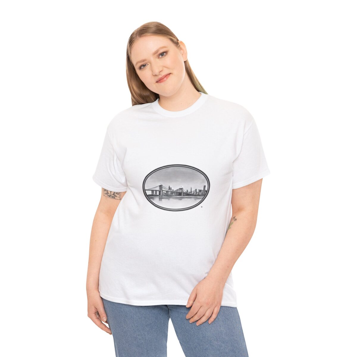 Woman wearing a white T-shirt with an oval Brooklyn skyline graphic.