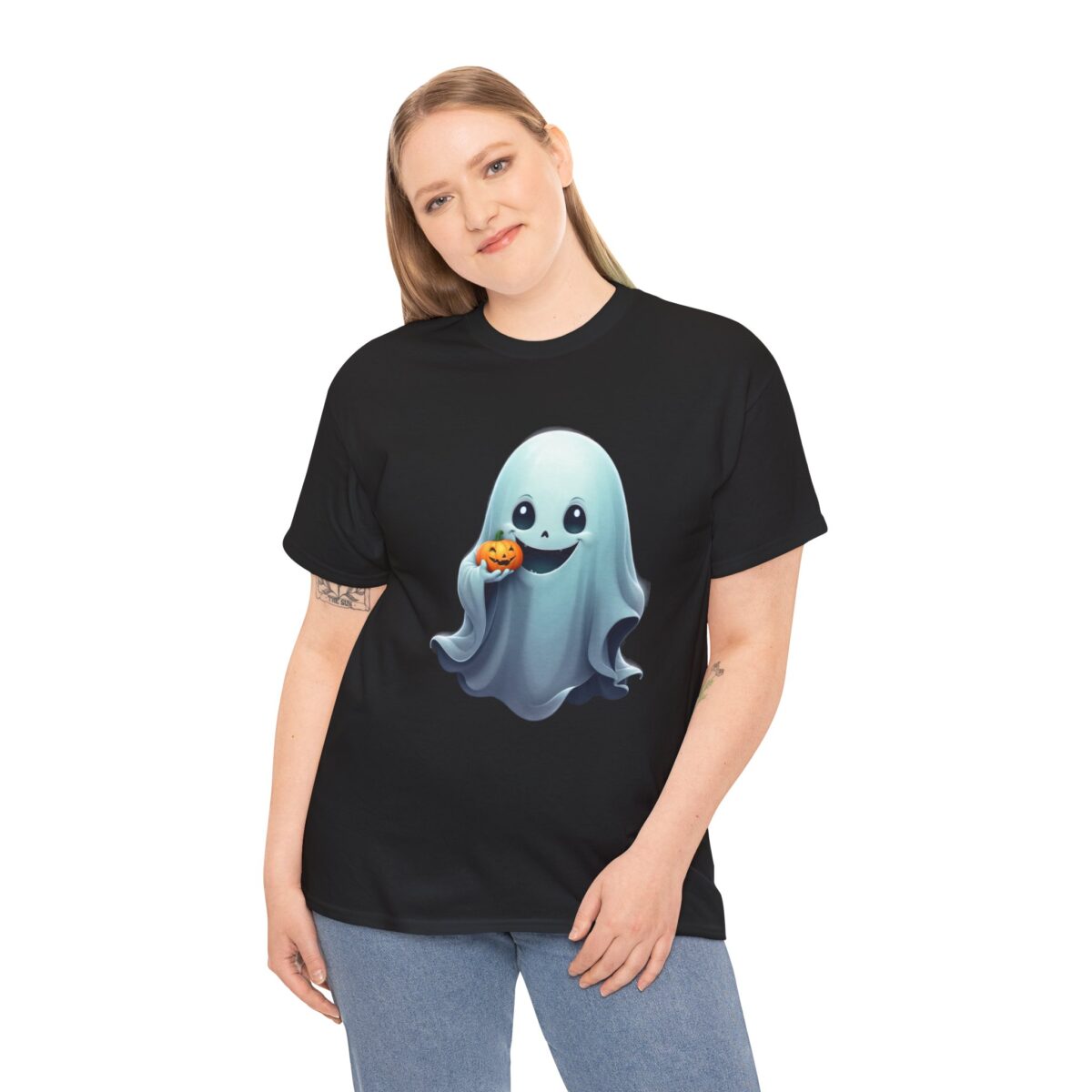 Woman wearing Ghost T Shirt with a cute ghost holding a pumpkin on a black background