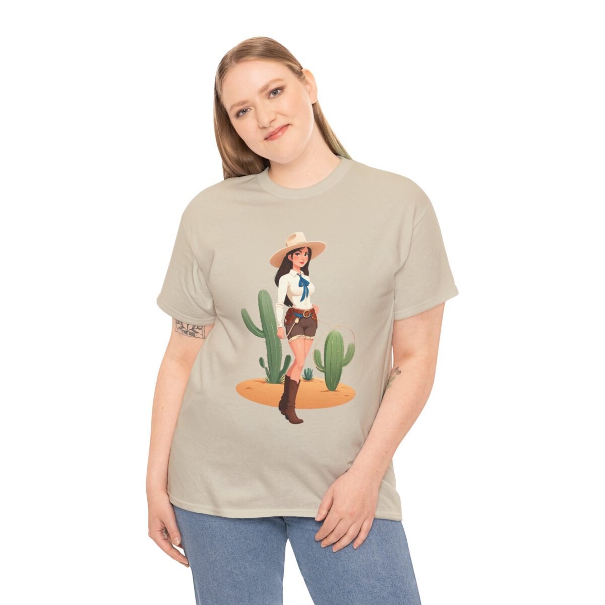 Woman wearing a beige cowgirl t-shirt with a Western-themed illustration.