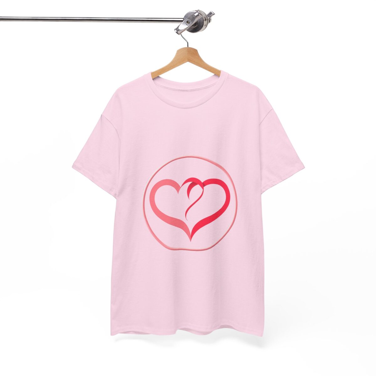 Girlfriend T Shirt with heart motif hanging on a wooden hanger, pink and stylish.