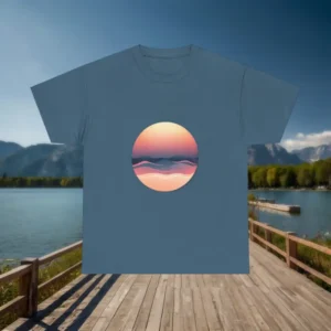 Flat lay of a blue t-shirt with a circular sunset and wave abstract graphic