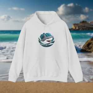 Light grey hoodie with shark teeth design displayed on a beach background