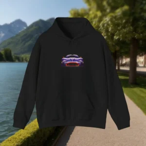 Black hoodie with purple racing car graphic laid flat on a lakeside path