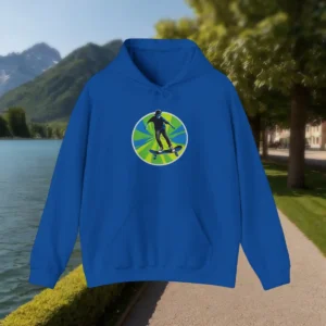 Flat-lay of blue hoodie with skateboarder silhouette on green sunburst background