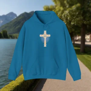 Blue hoodie laid flat with a detailed golden cross printed on the chest