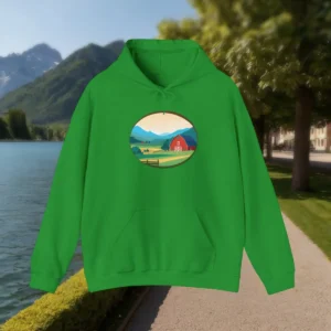 Green hoodie with a countryside farm scene design on the front