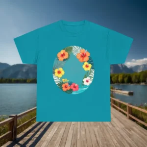 Turquoise t-shirt with a round Hawaiian floral wreath design laid flat on a wooden dock