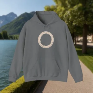 Flat lay of dark grey hoodie with braided cream circle design on chest