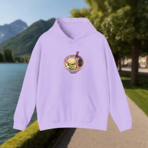 Lavender hoodie with colorful ramen noodle bowl graphic laid flat outdoors