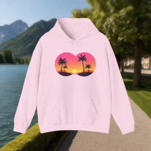 Flat-lay of a light pink hoodie with a tropical palm tree sunset illustration