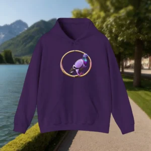 Flat-lay of a purple hoodie with a pigeon inside a rustic golden ring graphic