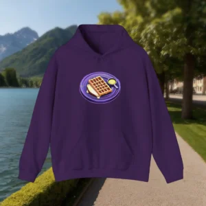 Flat-lay of a purple hoodie with a graphic of a waffle, syrup, and plate in the center