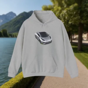 Grey hoodie with a printed silver sports car, displayed in front of a scenic mountain lake.